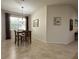 Bright dining area featuring tile floors, natural light, and seamless access to other living areas at 3205 Majestic View Dr, Lutz, FL 33558