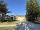 Inviting single-story home with a brick driveway, two-car garage, and a well-maintained front lawn at 3205 Majestic View Dr, Lutz, FL 33558