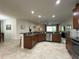 Spacious kitchen featuring stainless steel appliances and a large island, perfect for entertaining at 3205 Majestic View Dr, Lutz, FL 33558