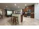 Modern kitchen with stainless steel appliances, breakfast bar and adjacent living area at 3205 Majestic View Dr, Lutz, FL 33558