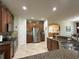 Open concept kitchen with stainless steel appliances and granite countertops at 3205 Majestic View Dr, Lutz, FL 33558