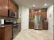 Spacious kitchen features stainless steel appliances and granite countertops at 3205 Majestic View Dr, Lutz, FL 33558