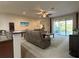 Inviting living room with sliding glass doors to patio at 3205 Majestic View Dr, Lutz, FL 33558