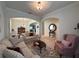 Comfortable living room with plush seating, arched entries, and views into the adjacent dining area at 3205 Majestic View Dr, Lutz, FL 33558