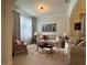 Cozy living room featuring comfortable seating, soft lighting, and a decorative area rug at 3205 Majestic View Dr, Lutz, FL 33558