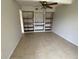Bright dining area with built-in shelving and tile flooring at 3223 Coats Rd, Zephyrhills, FL 33541