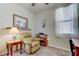 Bedroom featuring a cozy chair, a side table, and a window at 34747 Telluride Ln, Zephyrhills, FL 33541