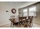 Well-lit dining room featuring a large table with seating for six and two windows at 34747 Telluride Ln, Zephyrhills, FL 33541