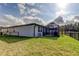 Beautiful backyard with a screened patio, lush lawn, and fenced border offering water views at 34747 Telluride Ln, Zephyrhills, FL 33541