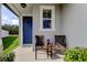 Inviting front porch features seating for enjoying quiet moments outdoors at 34747 Telluride Ln, Zephyrhills, FL 33541