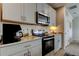 Well-equipped kitchen with modern appliances and ample cabinet space at 34747 Telluride Ln, Zephyrhills, FL 33541