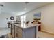 Bright kitchen island with granite countertop and seating for casual dining at 34747 Telluride Ln, Zephyrhills, FL 33541