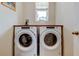 Laundry room featuring Whirlpool washer and dryer units at 34747 Telluride Ln, Zephyrhills, FL 33541