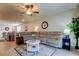 Inviting living room featuring a comfortable sofa, ceiling fan, and view of the kitchen at 34747 Telluride Ln, Zephyrhills, FL 33541
