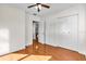 Bedroom with hardwood floors, a ceiling fan, closet space and an open doorway at 4053 11Th N Ave, St Petersburg, FL 33713