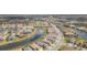 Bird's eye view of a well-planned neighborhood with lakes and community amenities at 4920 Sevilla Shores Dr, Wimauma, FL 33598