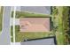 Overhead view of a single-Gathering home featuring a tile roof and a manicured lawn at 4920 Sevilla Shores Dr, Wimauma, FL 33598