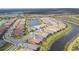 Beautiful aerial shot of a residential neighborhood with well-maintained homes and scenic water views at 4920 Sevilla Shores Dr, Wimauma, FL 33598