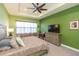 Bedroom with neutral colors and a tray ceiling at 4920 Sevilla Shores Dr, Wimauma, FL 33598