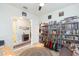 Versatile bedroom with guitars, books, and a sitting area leading to the entryway at 4920 Sevilla Shores Dr, Wimauma, FL 33598