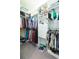 Walk-in closet featuring custom organization shelves and hanging rods for optimal storage at 4920 Sevilla Shores Dr, Wimauma, FL 33598