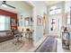 Hallway flowing into a living space and featuring an entryway with a decorative rug at 4920 Sevilla Shores Dr, Wimauma, FL 33598