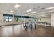 Bright game room with table tennis, large windows, and ample space for activities at 4920 Sevilla Shores Dr, Wimauma, FL 33598