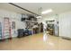 Well-organized garage with ample storage, shelving, and epoxy flooring at 4920 Sevilla Shores Dr, Wimauma, FL 33598