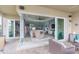 Open floor plan featuring a spacious living room with sliding glass doors to an outdoor patio at 4920 Sevilla Shores Dr, Wimauma, FL 33598