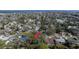 Aerial view of a single story home nestled in a community near waterfront property, showcasing neighborhood layout at 4964 Huntington Ne St, St Petersburg, FL 33703