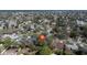 Aerial view of a neighborhood with numerous waterways and single Gathering homes with mature landscaping at 4964 Huntington Ne St, St Petersburg, FL 33703