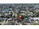 Aerial view of single-story home nestled in a community near waterfront property, showcasing neighborhood layout at 4964 Huntington Ne St, St Petersburg, FL 33703