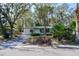 Quaint single-story home featuring a manicured front lawn and a cozy, inviting curb appeal at 4964 Huntington Ne St, St Petersburg, FL 33703