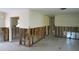 Open-concept living room featuring demoed walls, ready to customize with your own vision and creativity at 4964 Huntington Ne St, St Petersburg, FL 33703