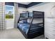 Charming bedroom featuring a bunk bed, neutral carpet, and bright window at 5020 124Th E Ave, Parrish, FL 34219