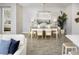 Elegant dining room with modern lighting, a large table, and stylish decor, perfect for entertaining guests at 5020 124Th E Ave, Parrish, FL 34219