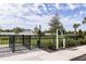 A fenced dog park with grass, pet-friendly amenities, and a welcome sign at 5020 124Th E Ave, Parrish, FL 34219
