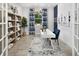Stylish office space with ample natural light, built-in shelving, and a comfortable workspace at 5020 124Th E Ave, Parrish, FL 34219