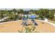 Community playground featuring play structure and benches, surrounded by lush landscaping at 5020 124Th E Ave, Parrish, FL 34219