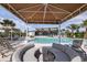 Inviting covered seating near a community pool; perfect for relaxation and socializing at 5020 124Th E Ave, Parrish, FL 34219