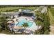 Aerial view of community pool and amenity center, showcasing lounging areas and landscaping at 5020 124Th E Ave, Parrish, FL 34219