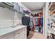 Walk-in closet with clothing racks, shelving, and storage at 5526 Silver Sun Dr, Apollo Beach, FL 33572