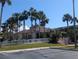 A clubhouse surrounded by a lush landscape and palm trees at 6315 Shoreline Dr # 3305, Madeira Beach, FL 33708