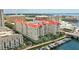 Beautiful aerial view of a condo complex with a pool, well-manicured landscaping, and boat docks at 700 S Harbour Island Blvd # 735, Tampa, FL 33602