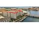 Scenic aerial view of a condo complex with pool, marina, and a bridge extending over a canal at 700 S Harbour Island Blvd # 735, Tampa, FL 33602