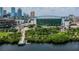 Aerial view showcasing waterfront community, featuring lush landscaping and modern buildings against a bright skyline at 700 S Harbour Island Blvd # 735, Tampa, FL 33602