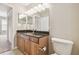 Bathroom with a dark granite vanity top and a decorative mirror at 700 S Harbour Island Blvd # 735, Tampa, FL 33602