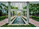 Picturesque courtyard with a long fountain, a pergola, benches, and lush greenery offers a relaxing retreat at 700 S Harbour Island Blvd # 735, Tampa, FL 33602