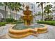This courtyard displays a large ornate fountain with detailed stone work, surrounded by lush landscaping at 700 S Harbour Island Blvd # 735, Tampa, FL 33602