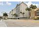 Multi-story residential building featuring modern architecture, palm trees, and street views, ideal for urban living at 700 S Harbour Island Blvd # 735, Tampa, FL 33602